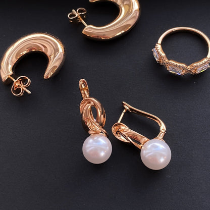 Apzeltīti auskari ar pērlīti un savītu dizainu - 18k - apzeltita - rotas